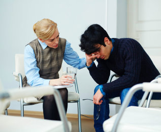 crying boy telling all his problems to a psychologist