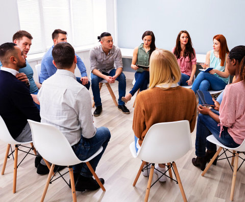 a group of friends doing an open forum