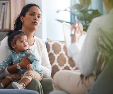 young woman sitting with her daughter