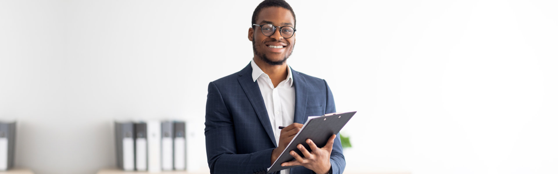 Happy young black male psychologist